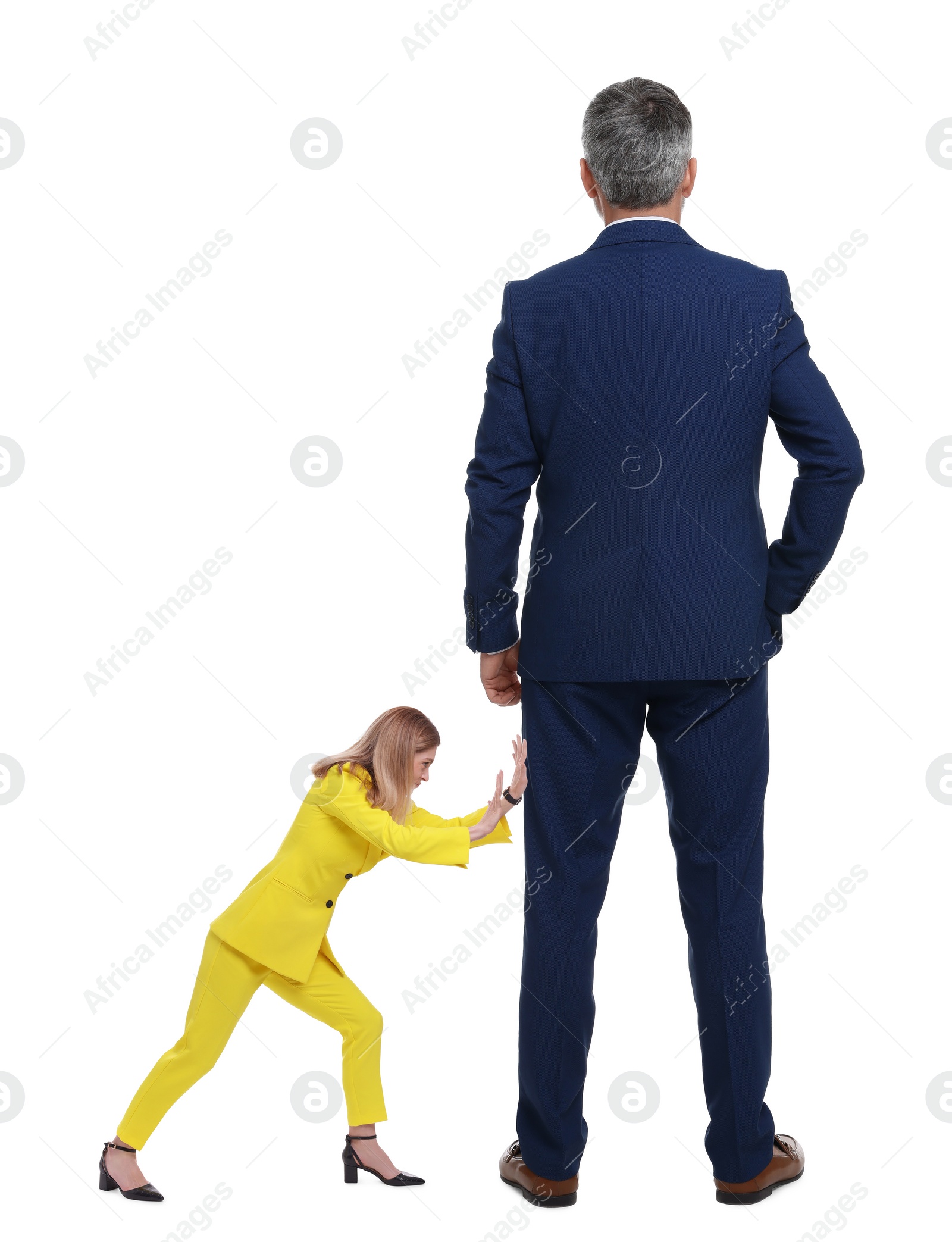Image of Small woman pushing giant man on white background
