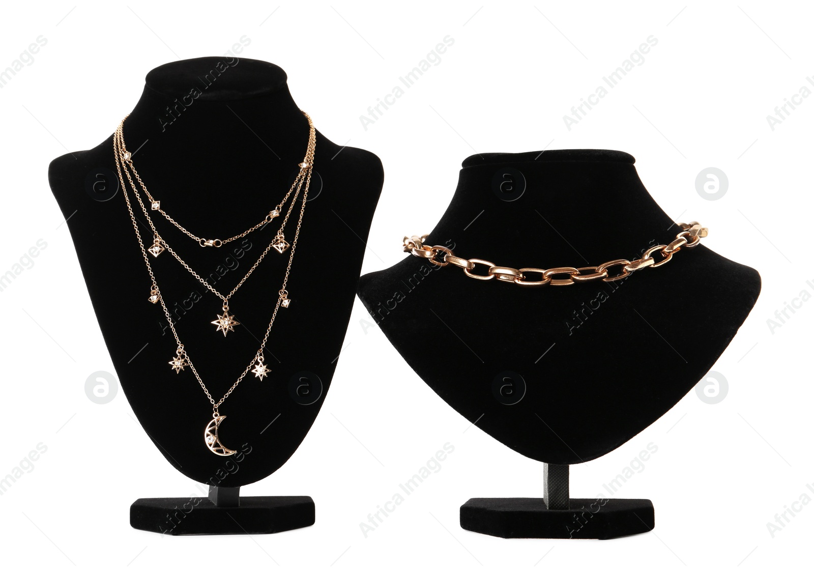 Photo of Stylish necklaces on jewelry busts against white background