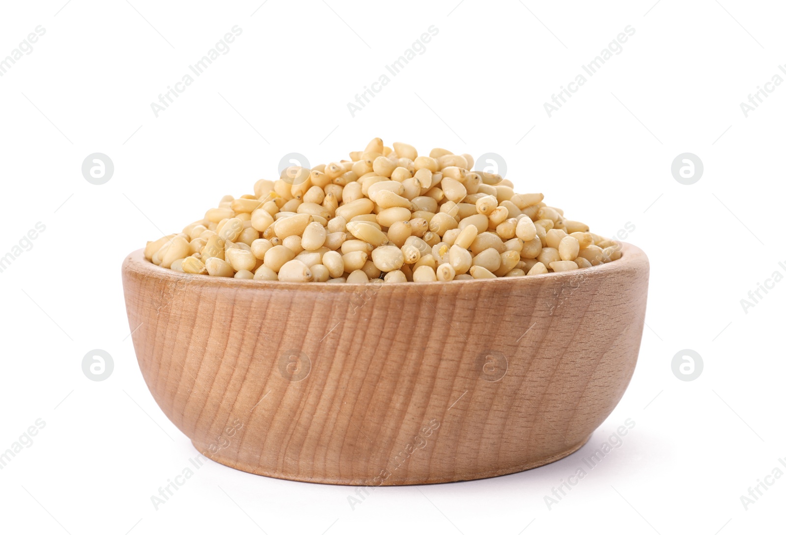 Photo of Bowl with pine nuts on white background