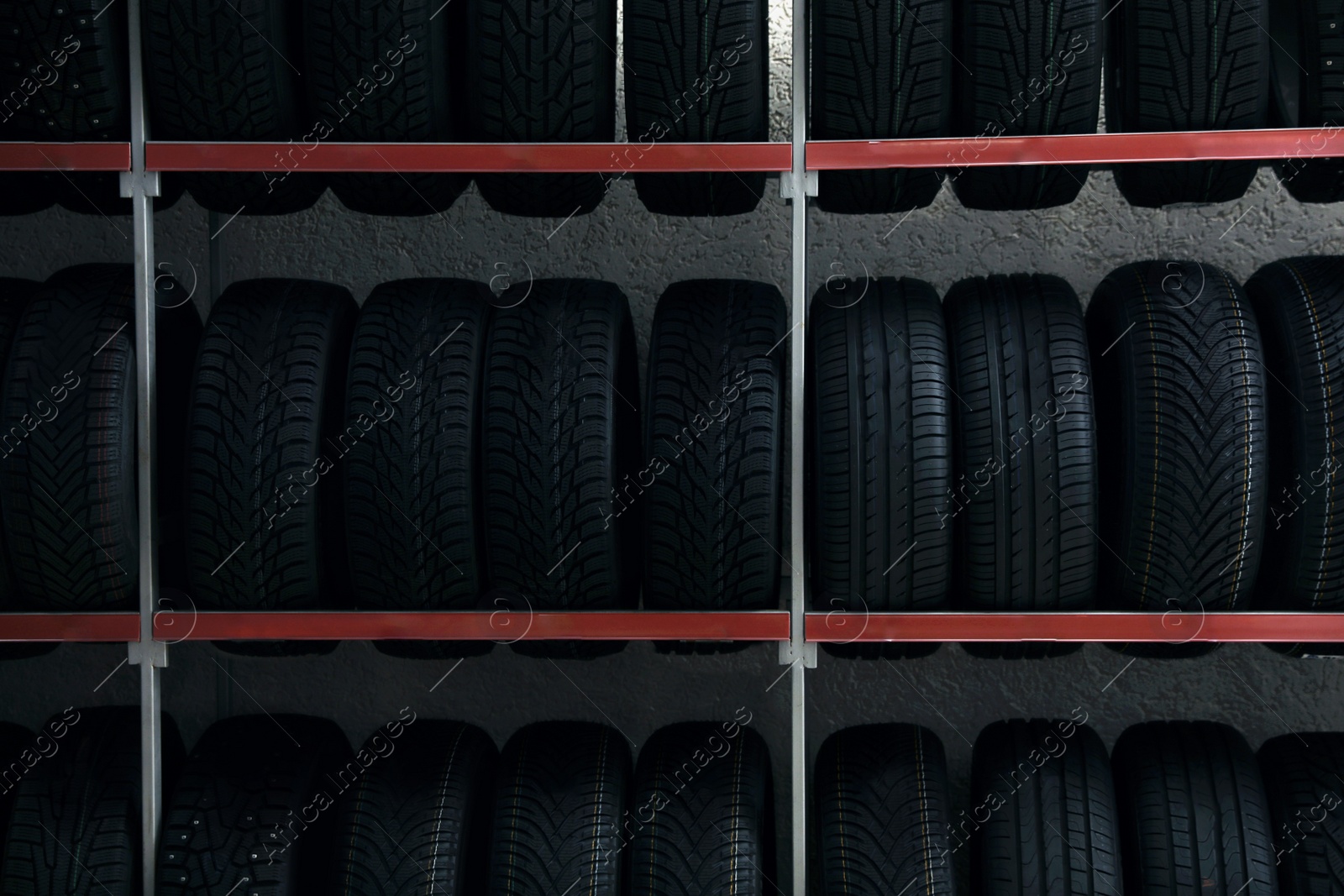 Photo of Car tires on rack in auto store