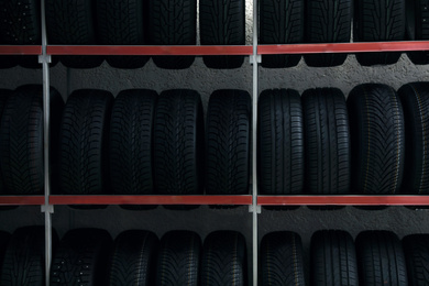 Car tires on rack in auto store