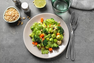 Photo of Salad with Brussels sprouts served on grey table, flat lay