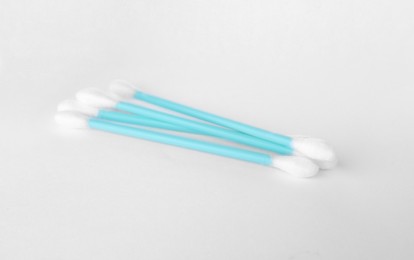 Many clean cotton buds on white background