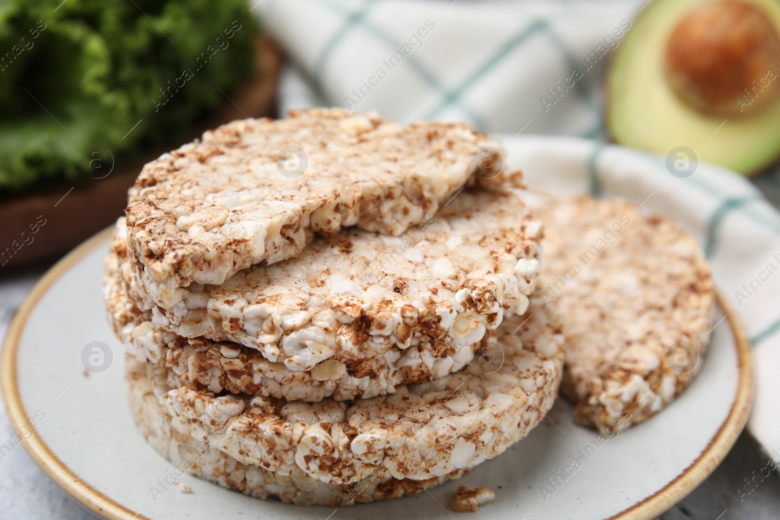 Photo of Crunchy buckwheat cakes on plate, closeup view