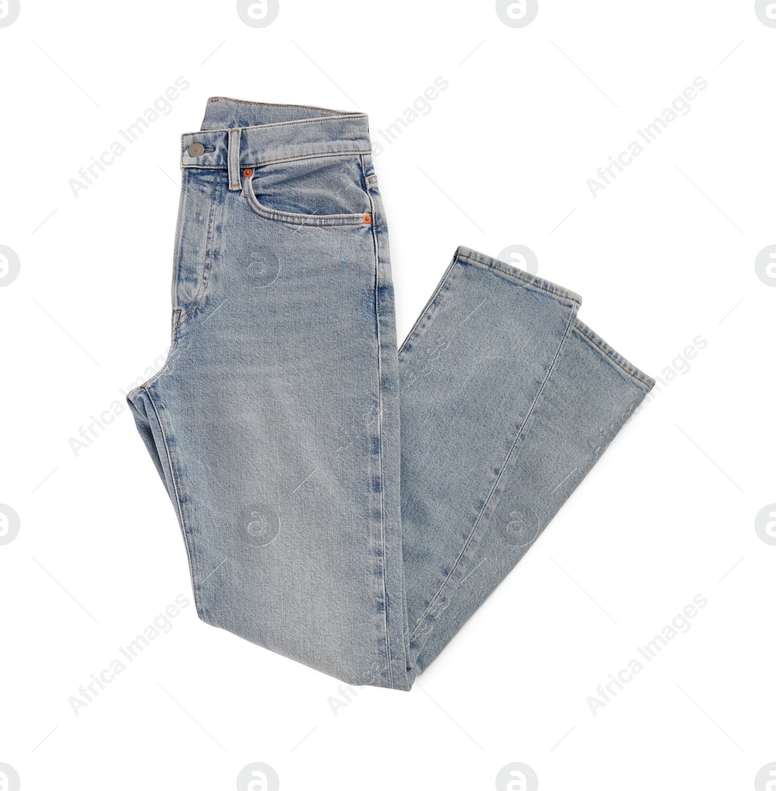 Photo of Light blue jeans isolated on white, top view. Stylish clothes