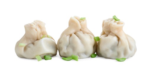 Photo of Three tasty khinkali (dumplings) and onion isolated on white. Georgian cuisine