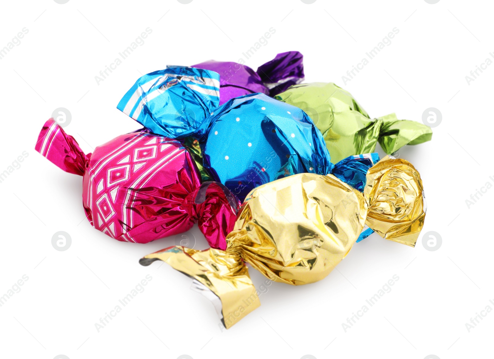 Photo of Pile of sweet candies in colorful wrappers on white background