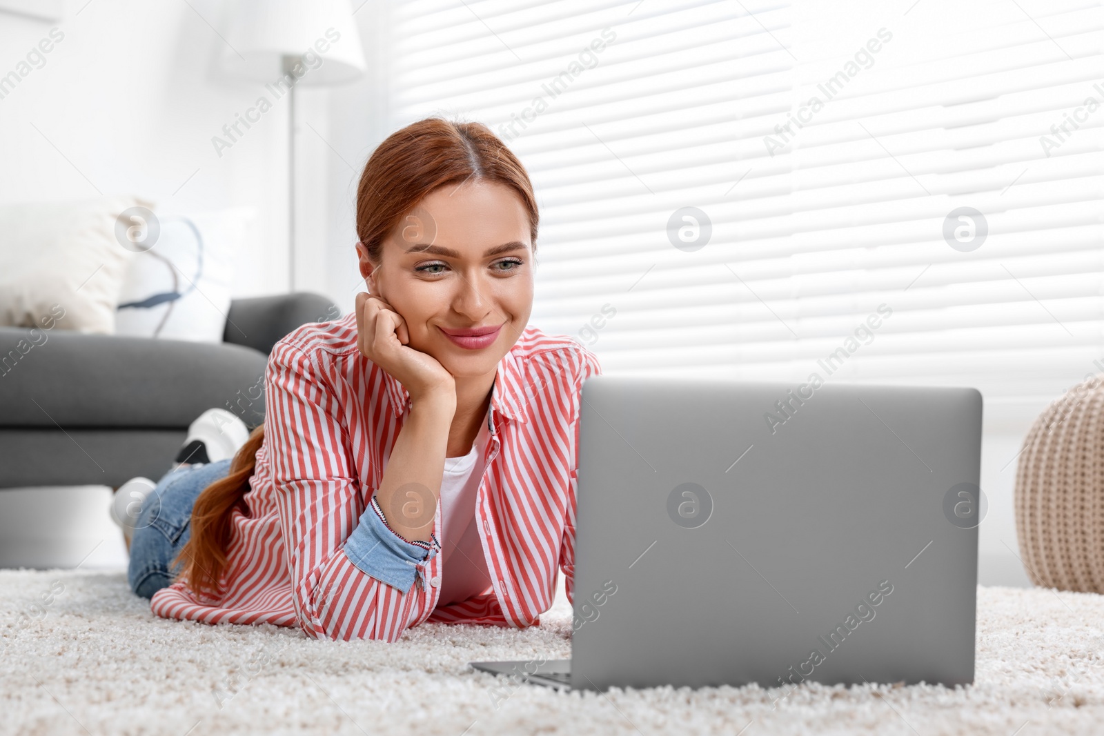 Photo of Woman having video chat via laptop at home