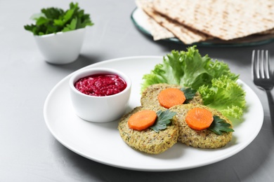 Photo of Plate of traditional Passover (Pesach) gefilte fish  on light background