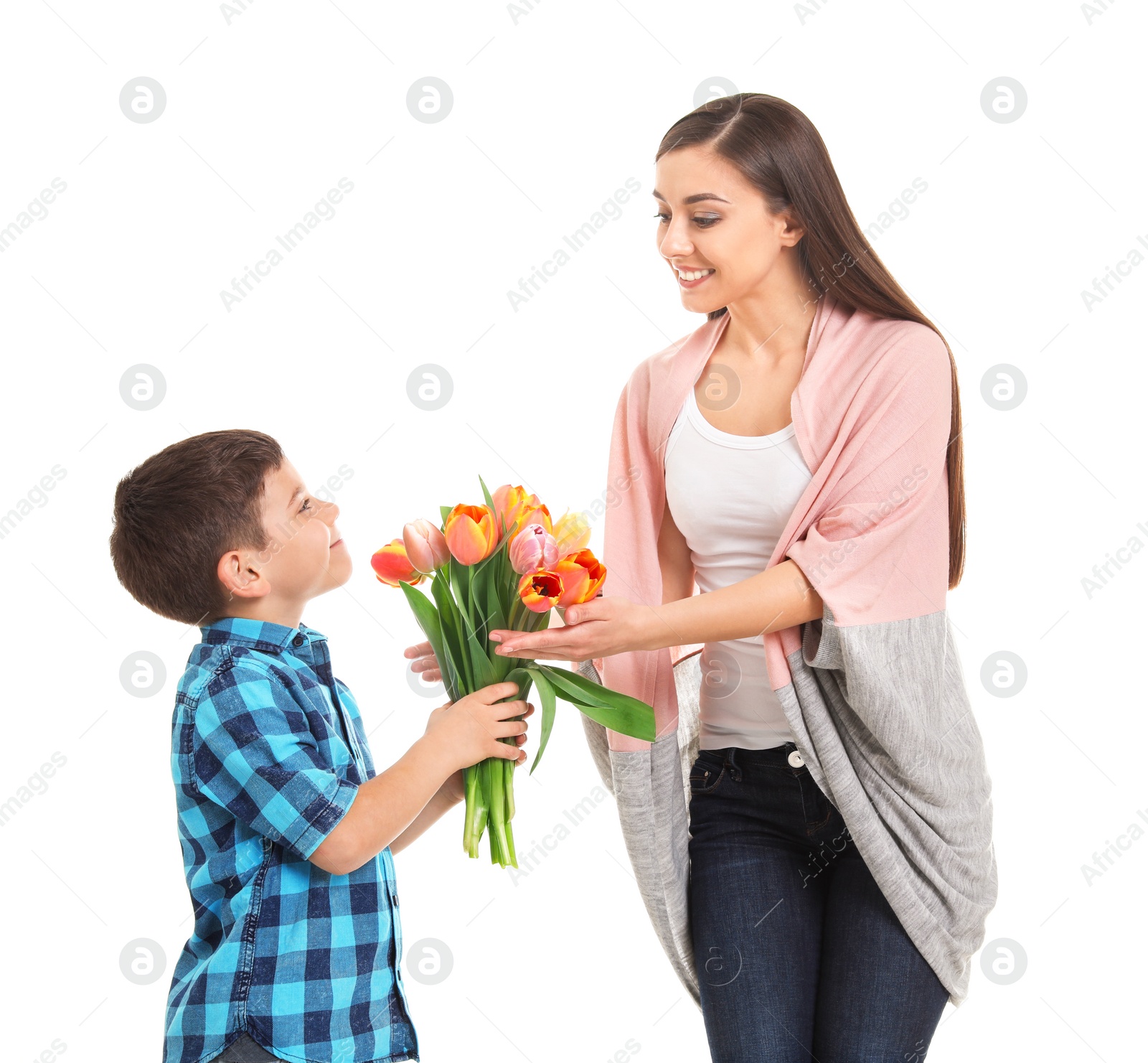 Photo of Happy woman receiving flowers from her son on white background. Mother's day celebration