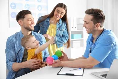 Family with child visiting doctor in hospital