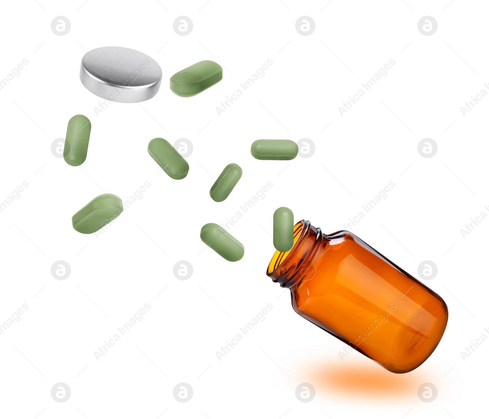 Image of Vitamin pills flying out from bottle on white background