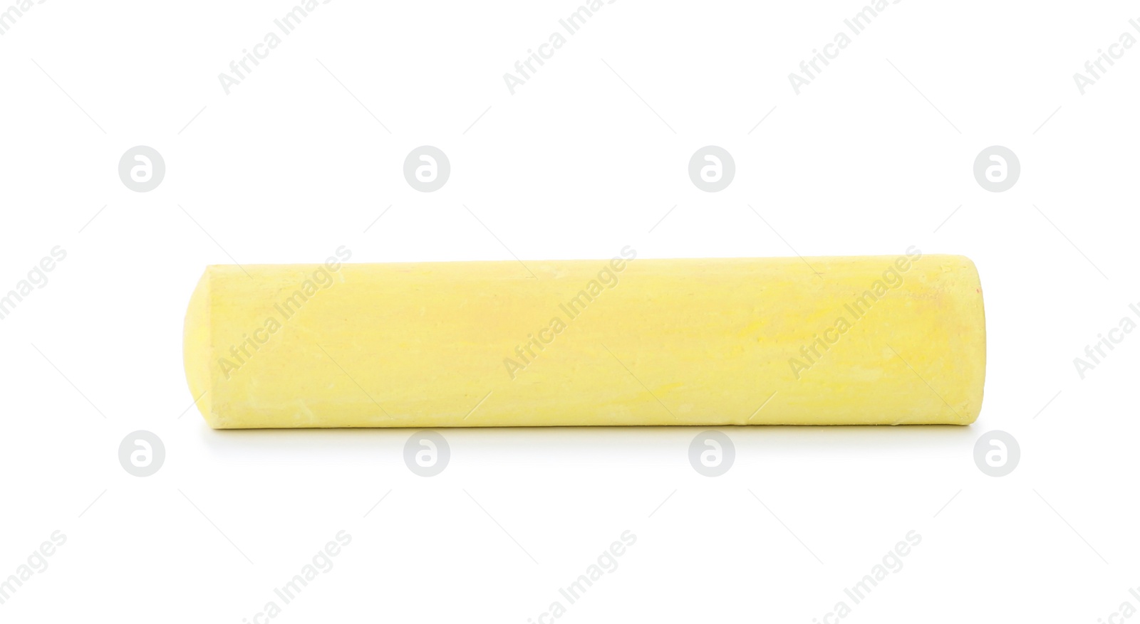 Photo of Yellow piece of chalk on white background