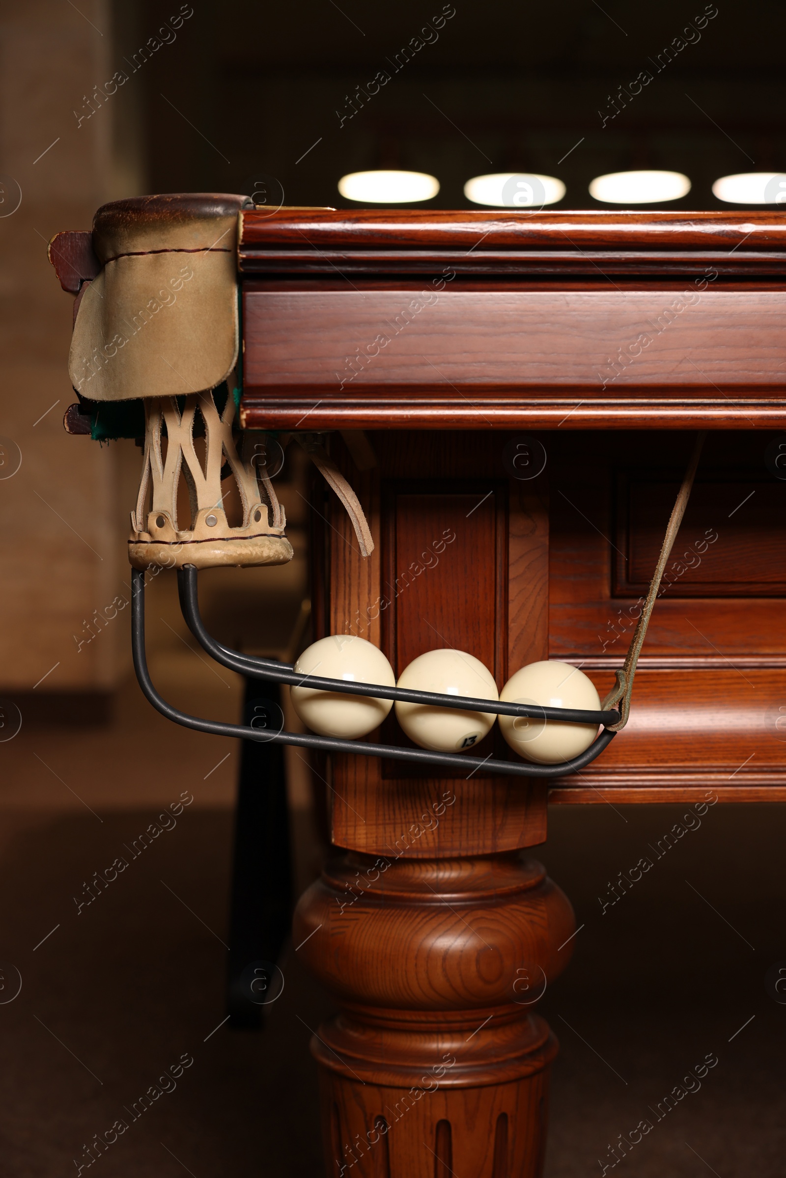 Photo of White balls in billiard table pocket indoors, closeup
