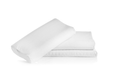 Photo of Clean soft orthopedic pillows on white background