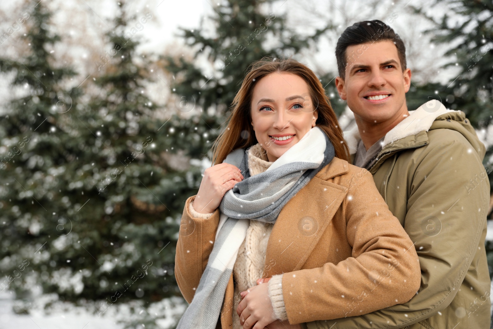 Photo of Beautiful happy couple outdoors on winter day