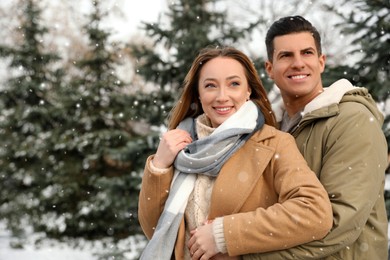 Photo of Beautiful happy couple outdoors on winter day