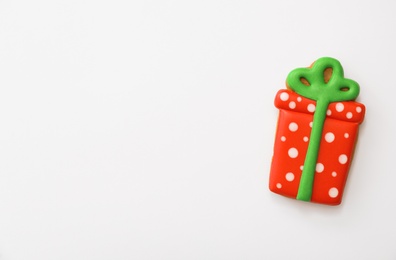 Photo of Christmas gift shaped gingerbread cookie on white background, top view