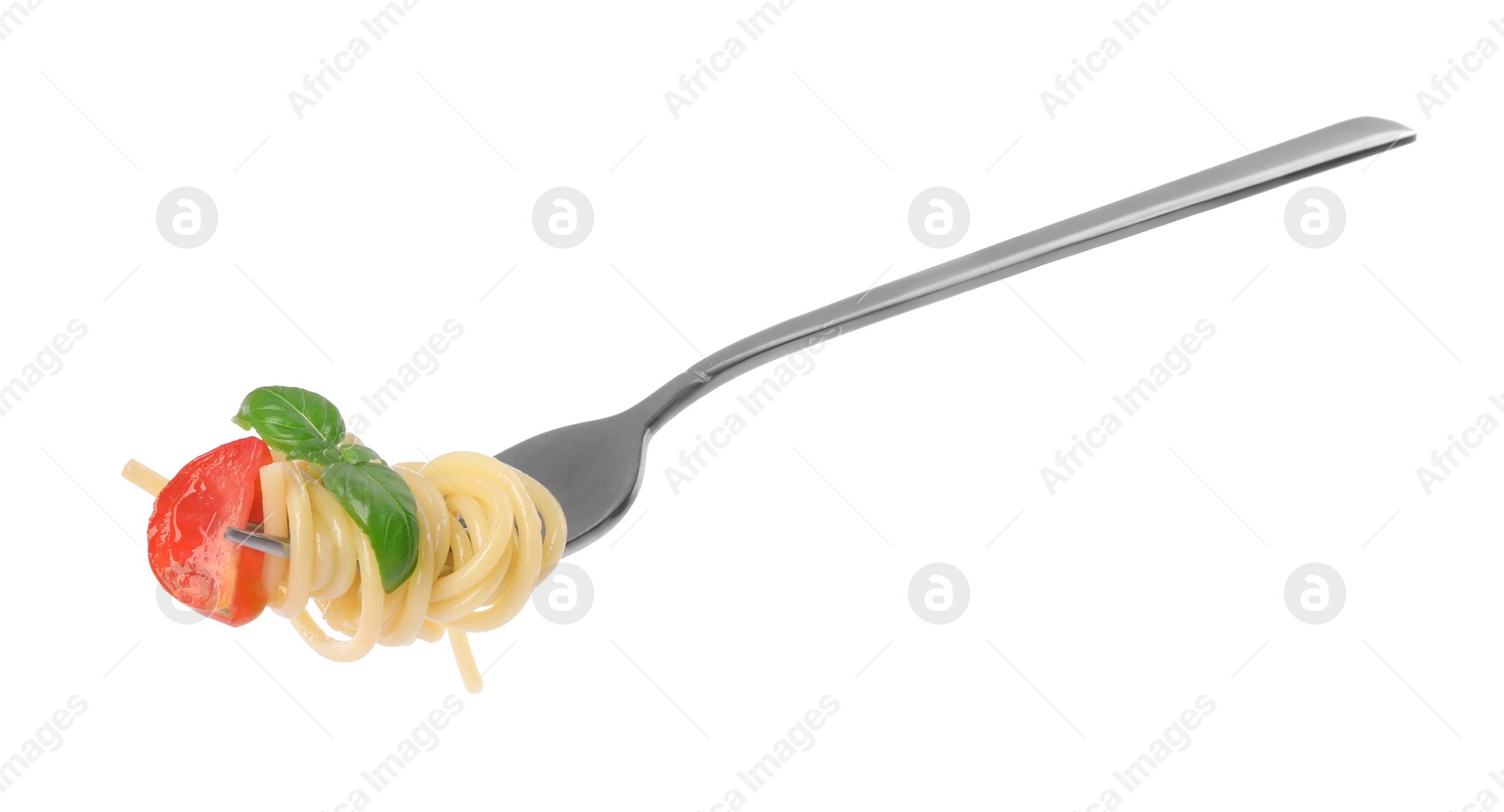 Photo of Fork with tasty pasta, piece of fresh tomato and basil isolated on white