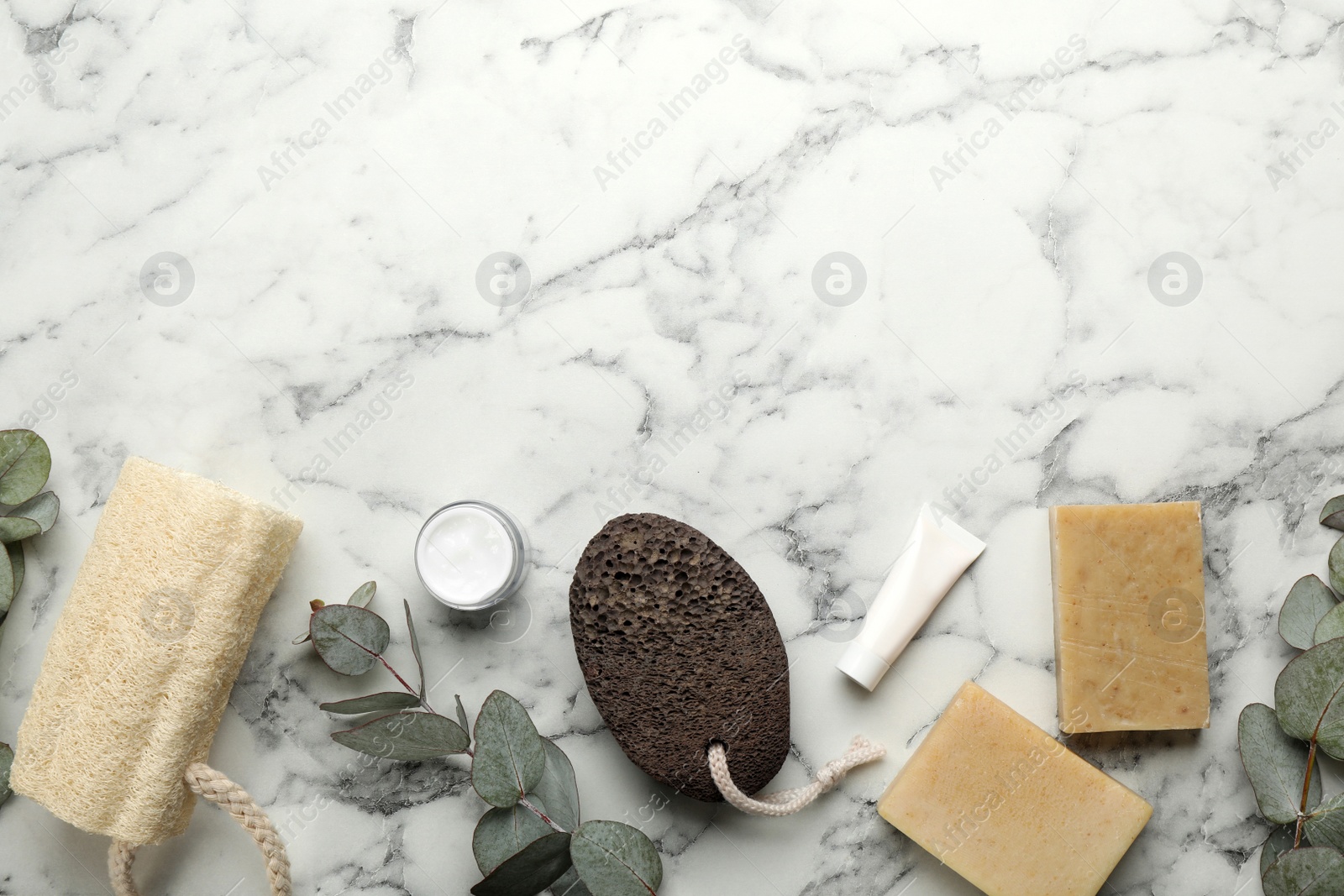 Photo of Flat lay composition with pumice stone on white marble background. Space for text