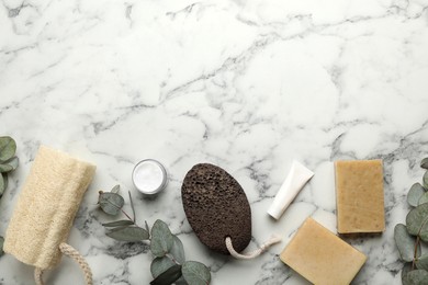 Flat lay composition with pumice stone on white marble background. Space for text