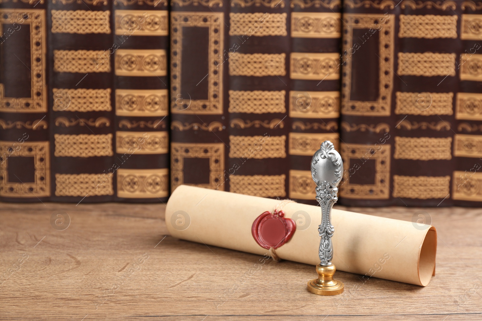 Photo of Notary's public pen and sealed document on wooden table