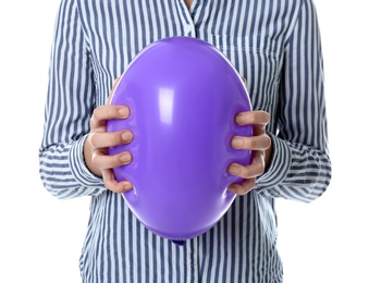 Photo of Woman squeezing purple balloon on white background, closeup