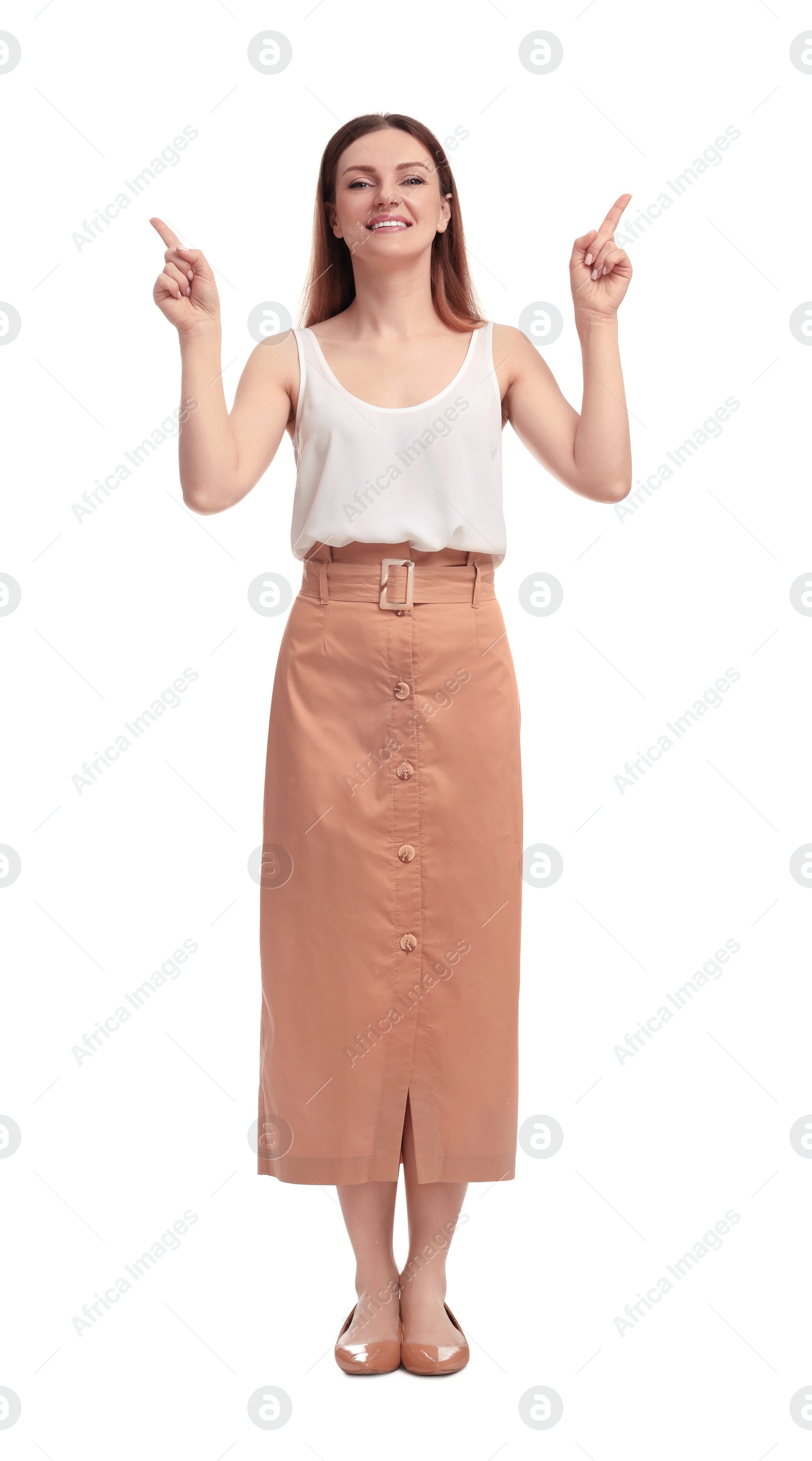 Photo of Beautiful businesswoman pointing at something on white background