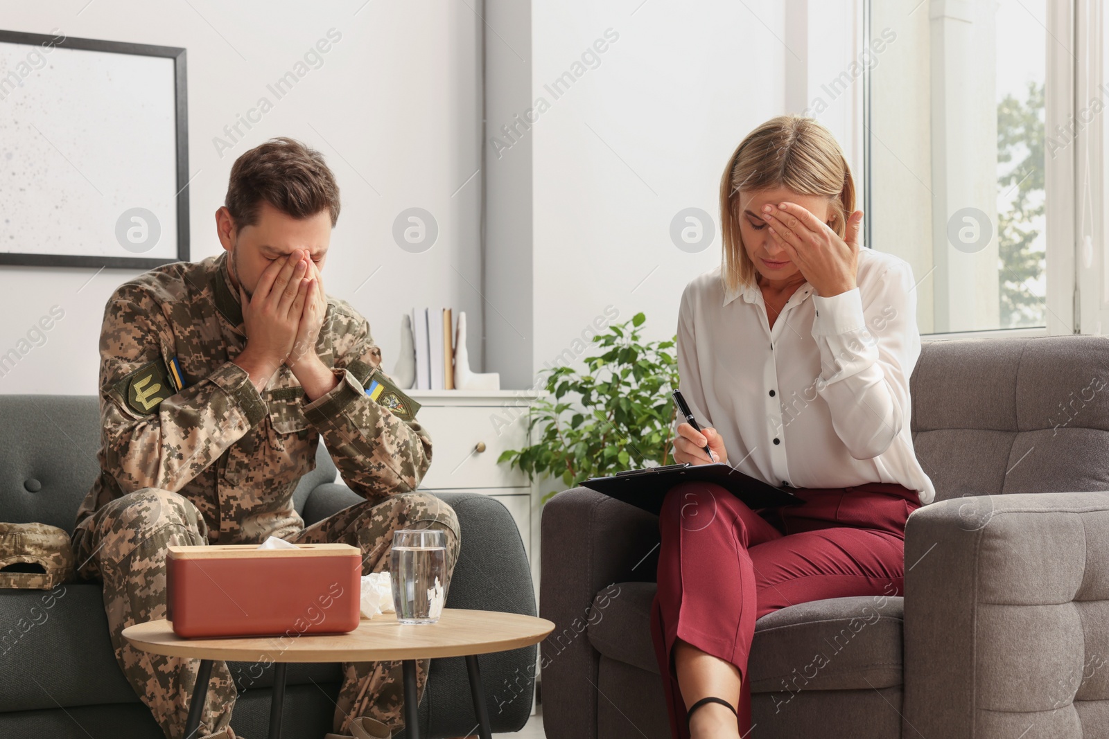 Photo of Psychologist working with military officer in office