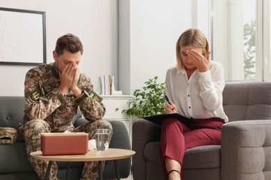 Psychologist working with military officer in office