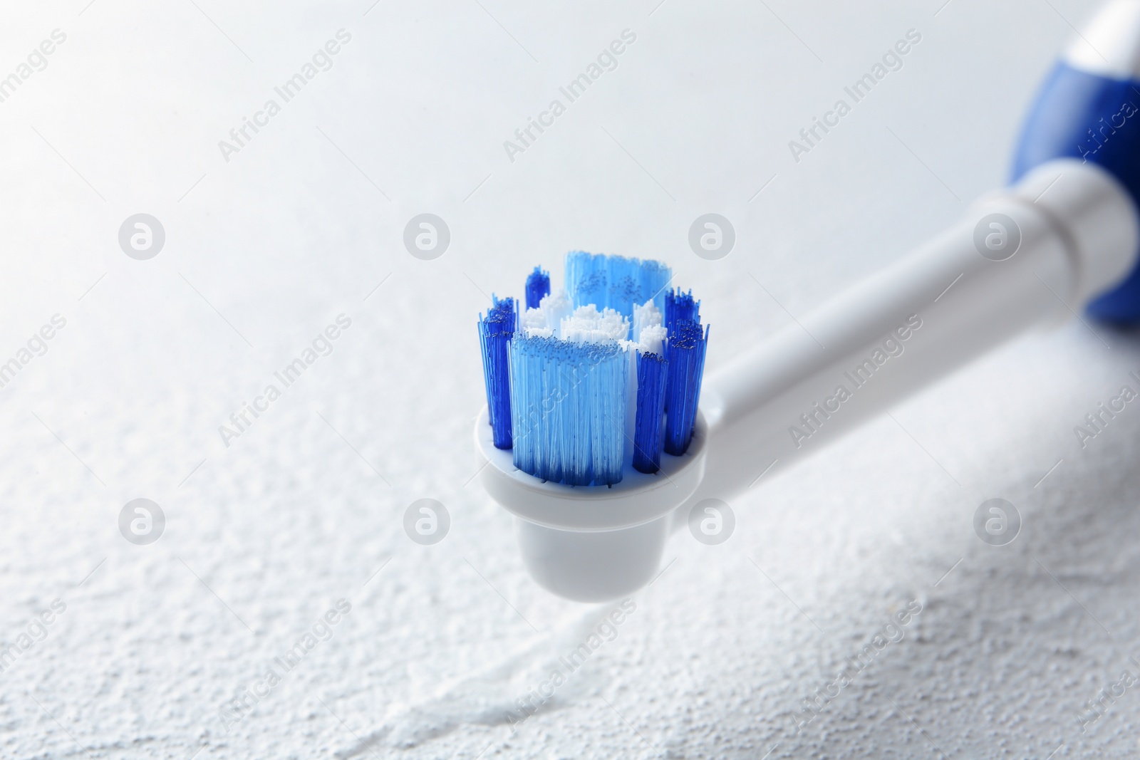 Photo of Electric toothbrush on light background, close up. Dental care