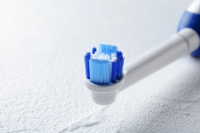 Electric toothbrush on light background, close up. Dental care