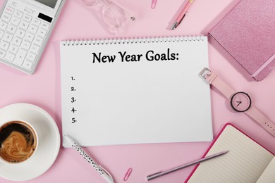 Inscription New Year Goals written in notebook and different objects on pink background, flat lay