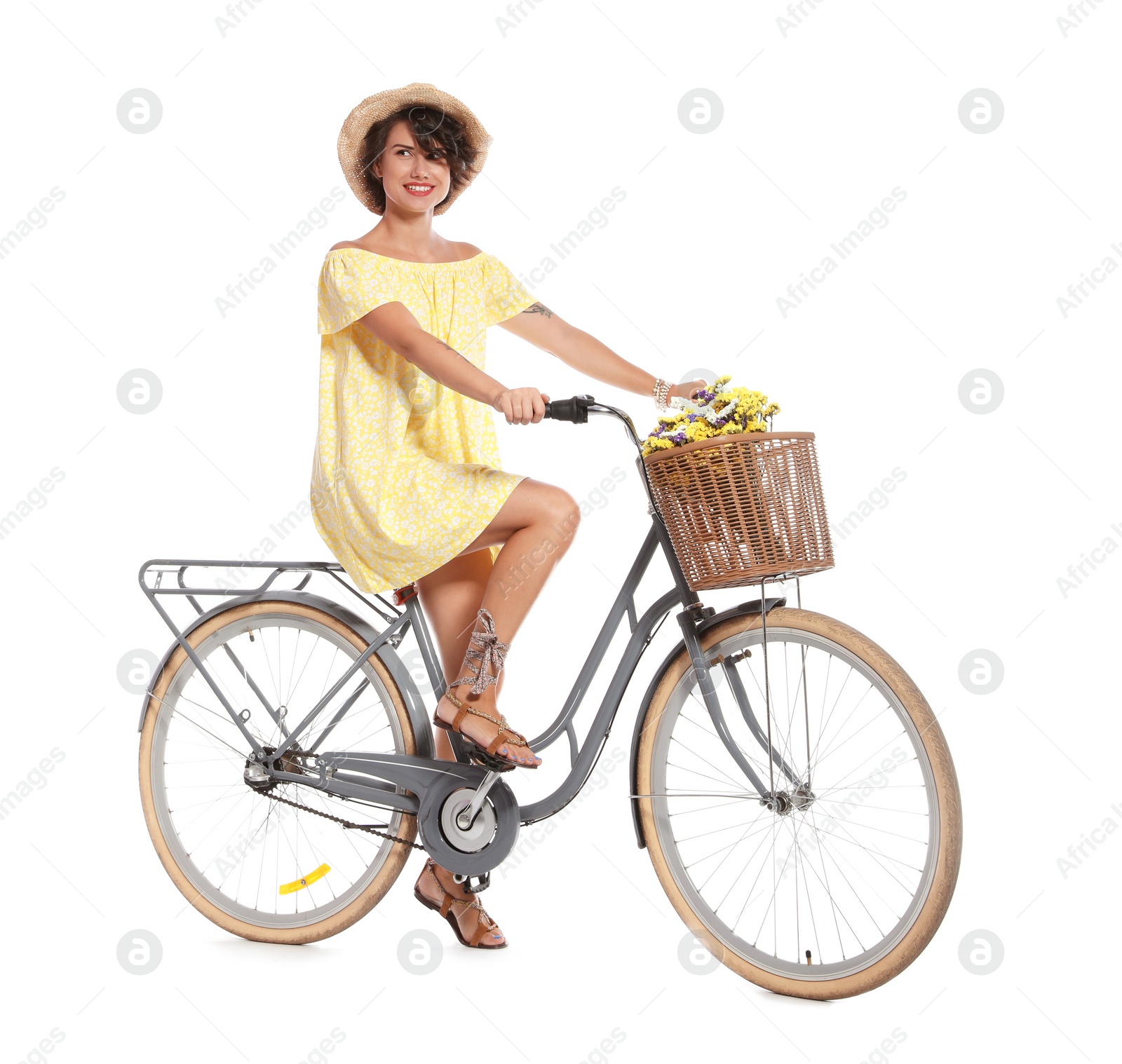 Photo of Portrait of beautiful young woman with bicycle on white background