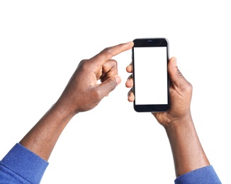 Photo of African-American man holding mobile phone with blank screen in hands on white background