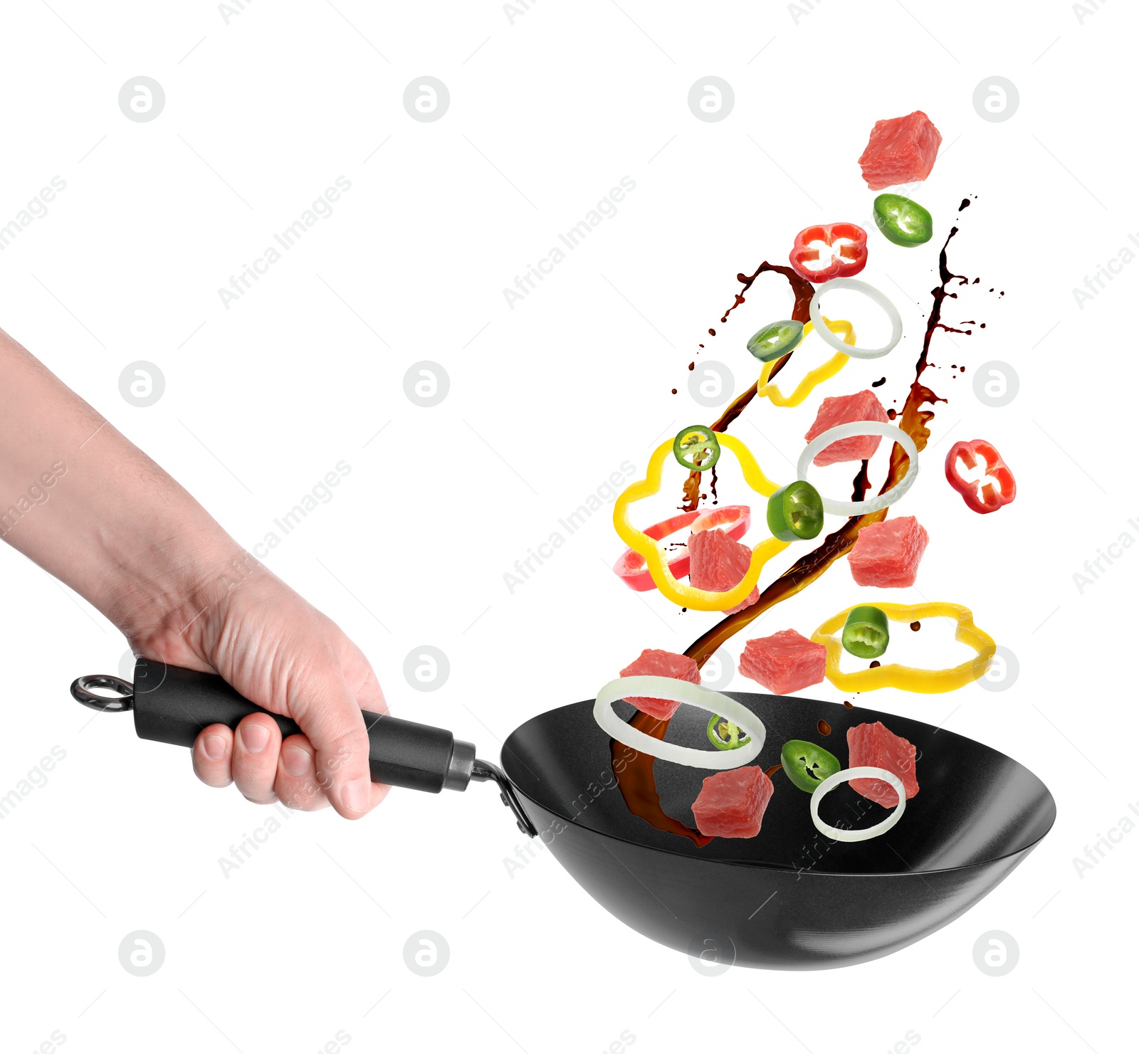 Image of Man tossing ingredients in wok on white background, closeup