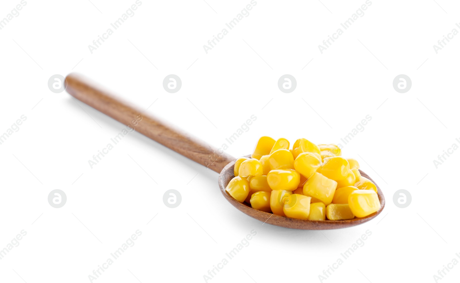 Photo of Delicious canned corn in spoon isolated on white