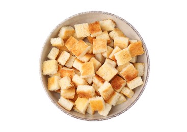Photo of Delicious crispy croutons in bowl on white background, top view