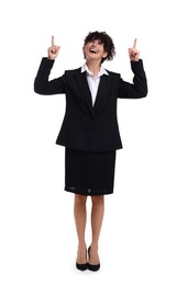 Photo of Beautiful happy businesswoman pointing at something on white background