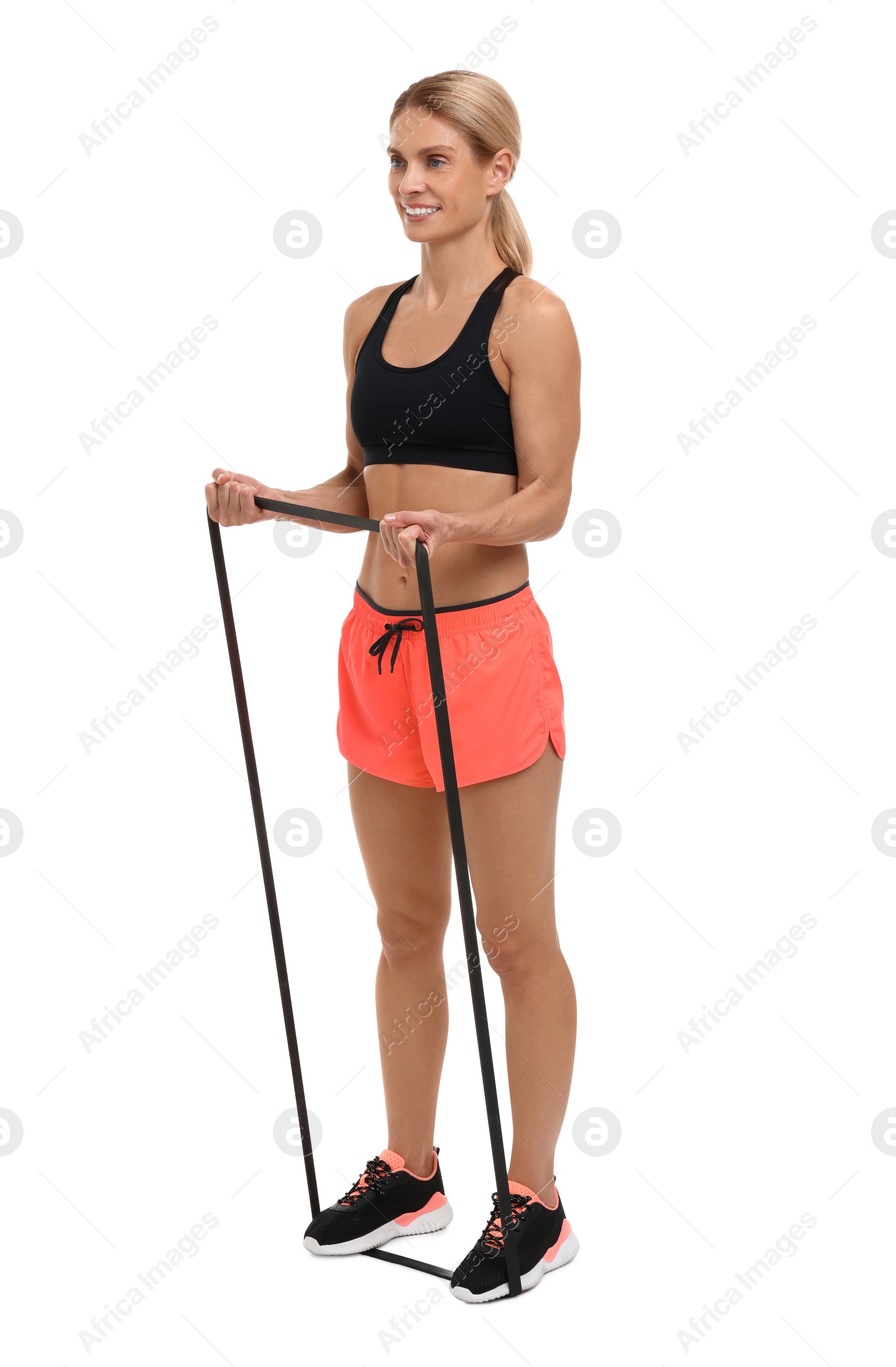 Photo of Woman exercising with elastic resistance band on white background