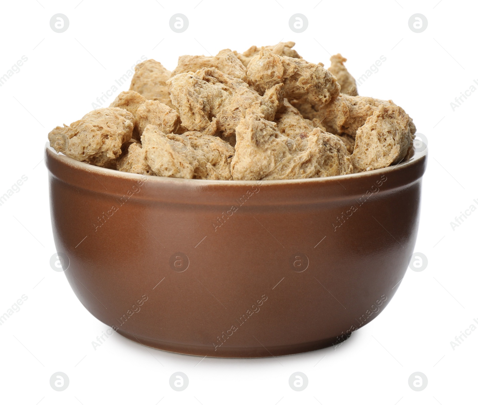 Photo of Dehydrated soy meat chunks in bowl on white background