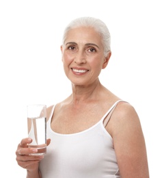 Portrait of beautiful mature woman with glass of water on white background