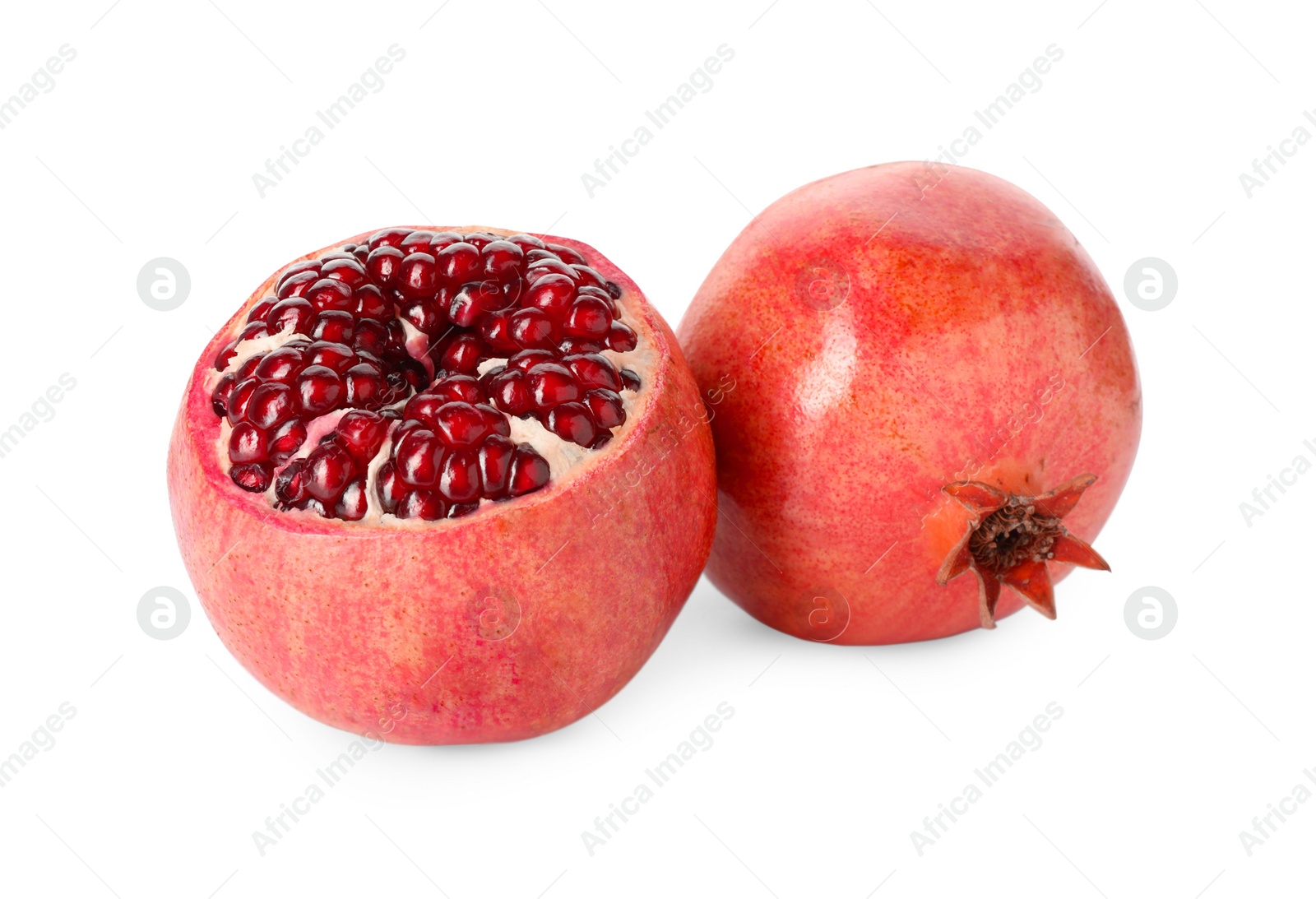 Photo of Many fresh ripe pomegranates isolated on white