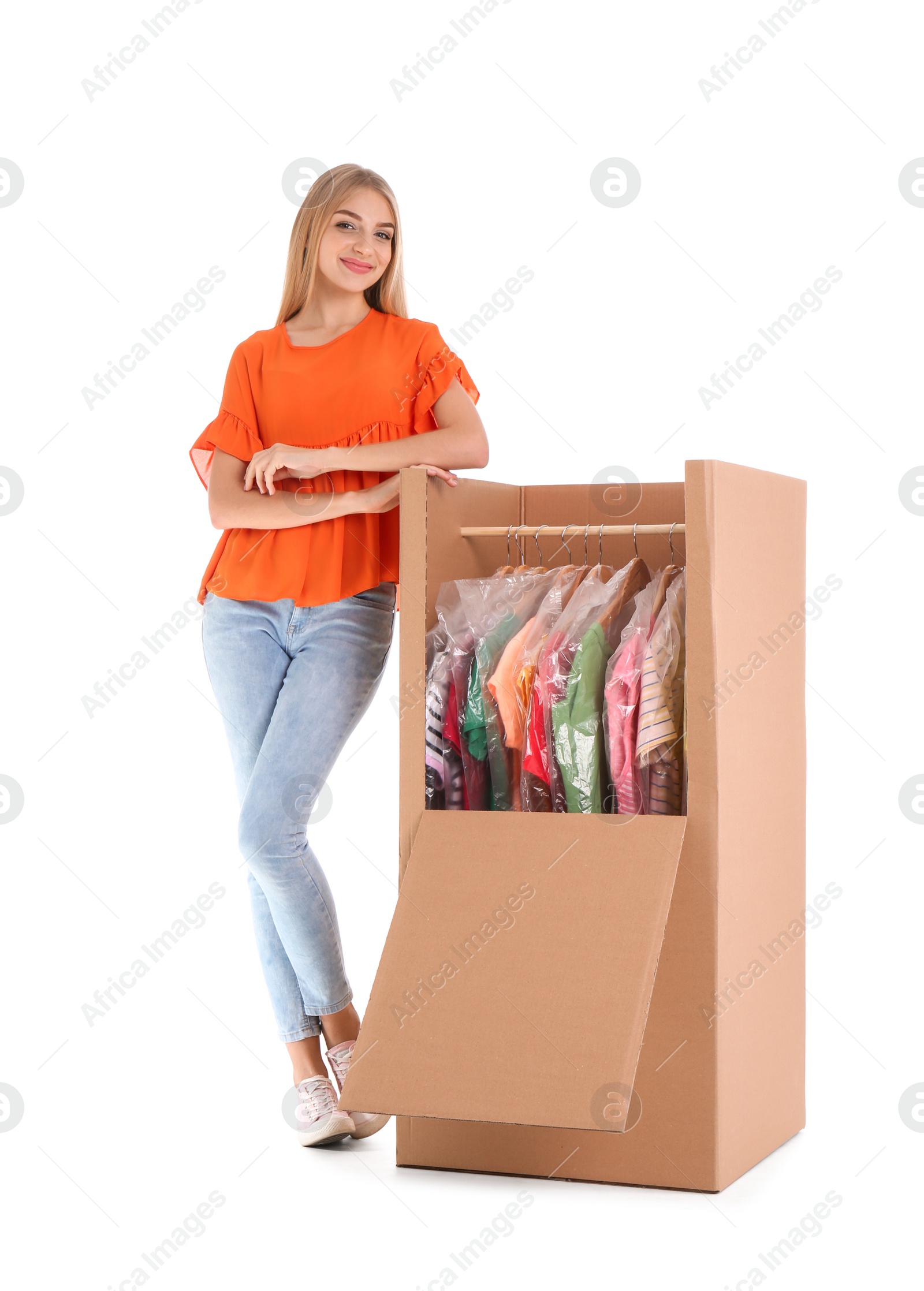 Photo of Young woman near wardrobe box on white background