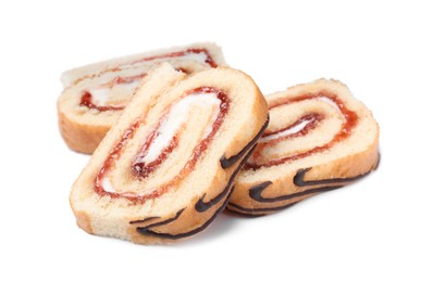 Slices of tasty cake roll with cream and jam on white background