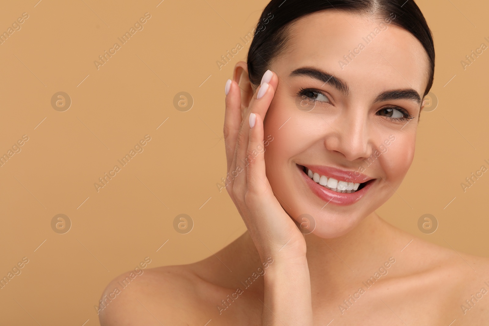 Photo of Beautiful woman with healthy skin on beige background. Space for text