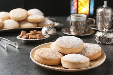 Composition with traditional cookies for Islamic holidays on table. Eid Mubarak