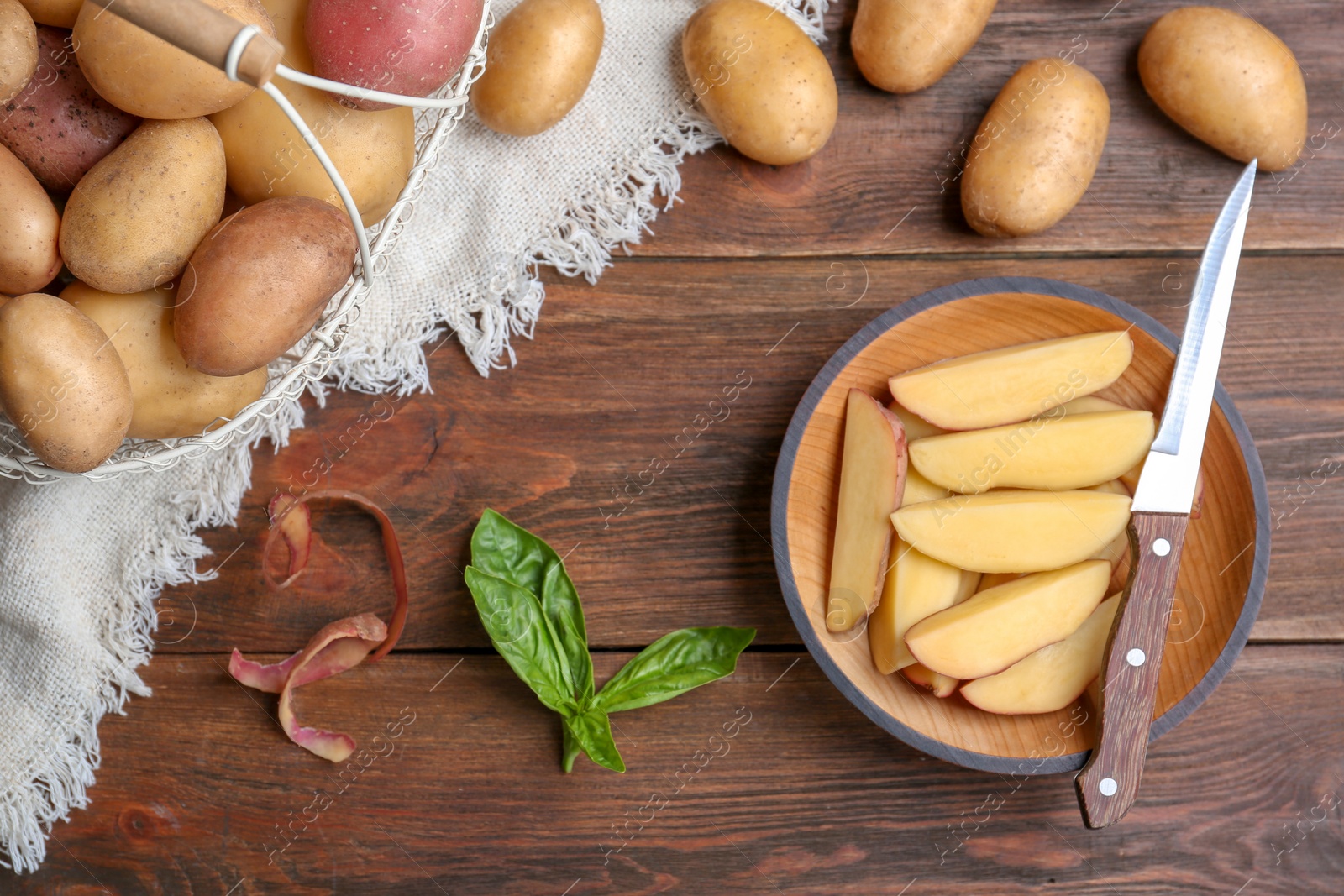 Photo of Flat lay composition with fresh organic potatoes on wooden background