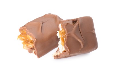 Photo of Pieces of tasty chocolate bar with nougat on white background