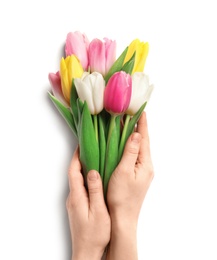 Photo of Girl holding beautiful spring tulips on light background, closeup. International Women's Day